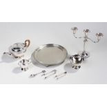 Silver plated tray, tea pot, two bowls, two sets of tongs,spoon and candleabra.