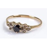 9 carat gold ring, set with a central sapphire, 1.2 grams