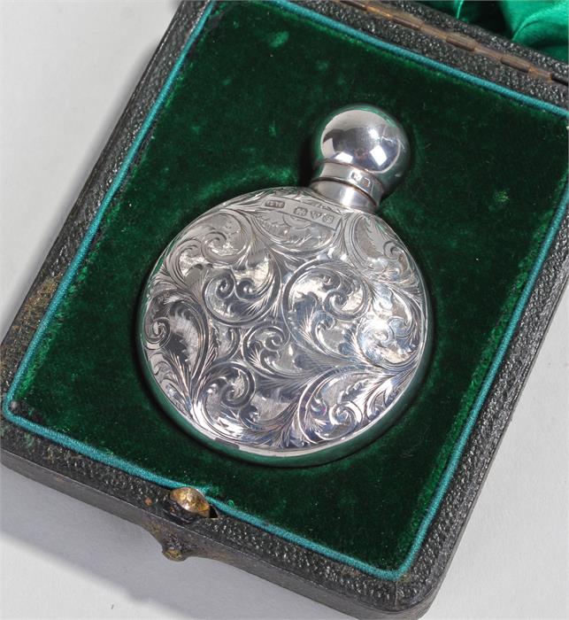 Edward VII silver cased perfume bottle, Chester 1906, maker GW, the foliate scroll circular body