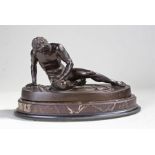 19th Century bronze, of a wounded classical figure resting on his shield and sword to the side, on a