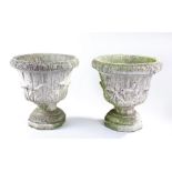 Pair of composite garden urns, with tulip design, 37cm high, (2)