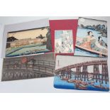 Japanese prints to include a Festival scene with lanterns from a bridge, Architectural scene with