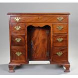 George III kneehole desk, the rectangular top above seven drawers to the kneehole and a inset