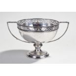George V silver twin handled trophy bowl, London 1914, the pierced edge flanked by a pair of handles