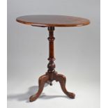 Victorian walnut occasional table, the oval top above a turned column and carved cabriole legs, 63cm