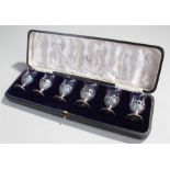 George V silver and glass spirit glasses, Birmingham 1919, maker Mappin & Webb, the shaped glass