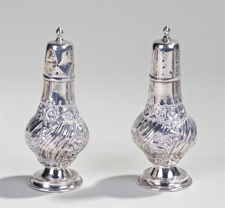 Pair of Victorian silver castors, Birmingham 1898, maker J. Wilmot, the acorn finials above