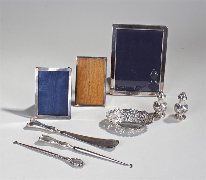 Silver objects, various dates and makers, to include three frames, two button hooks, shoe horn, a