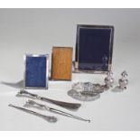 Silver objects, various dates and makers, to include three frames, two button hooks, shoe horn, a