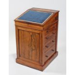 Regency rosewood Davenport, the sliding sloping fall enclosing four small drawers and storage