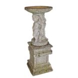 Composite bird bath, the dish top above a figural column and pedestal base, 135cm high