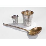 Two Russian silver beakers, 2.1oz in total weight, together with a brass spoon inscribed 1883 and