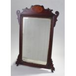 George III mirror, the shell inlaid top arched with scroll caps to the top and stylised leaf to