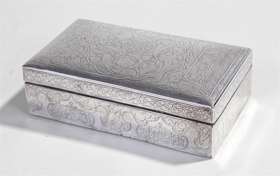 Middle Eastern silver cigarette box, engraved with script and scroll decoration, 15cm wide