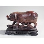 Chinese carved soapstone figure of a pig, the carved pig with a row of four piglets on a carved wood