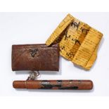 Japanese pipe case with tobacco pouch, 19th Century, the pipe case of woven cane with gilt and black