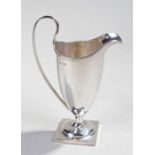 George V silver helmet jug, Birmingham 1915, makers mark rubbed, of typical form with a long body