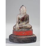 19th Century alabaster Buddha, seated position with purple and red painted decoration, raised on a