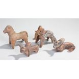 Four Indus Valley pottery figures, to include an elephant, a bull with humped back, another bull