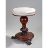 Victorian mahogany adjustable piano stool, the stuff over top above a turned tulip column and