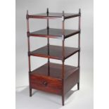 Victorian mahogany whatnot, of large proportions, the finial top above four graduated shelves and