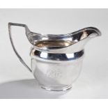 George III silver helmet jug, London 1807, maker JE, the jug with a monogram to the side, arched