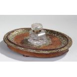 Victorian walnut and glass inkwell, the oval dished walnut base with applied brass foliate and