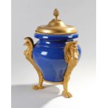 French First Empire gilt bronze and porcelain lidded urn, surmounted by a pineapple to the lid above