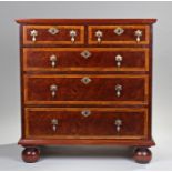 George I style walnut and feather band chest of drawers, the rectangular top above a pair of short