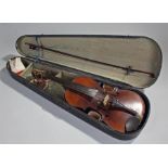 Violin and bow, the cased violin with bow to the lid, cased