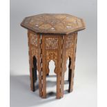 Middle Eastern mother of pearl inlaid occasional table, the polygon top with geometric inlaid design