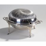 Silver plated warmer, the gadrooned hinged lid enclosing a pierced tray raised on slender arched