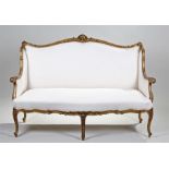 Louis XVI style gilt settee, the shell carved scroll frame with sweeping arms to the stuff over seat