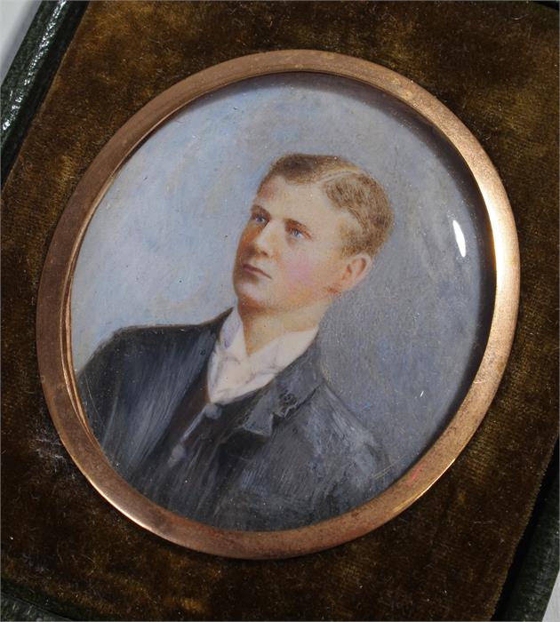 Early 20th Century British school, a miniature of a young gentleman, with blue jacket, oil on ivory,