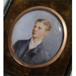 Early 20th Century British school, a miniature of a young gentleman, with blue jacket, oil on ivory,