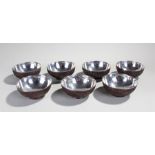 Set of seven late 19th Century Chinese export silver and coconut mounted bowl, the signed silver