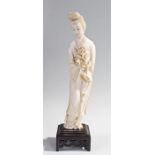 Large Chinese late 19th Century/early 20th Century ivory figure, of a lady with tied hair and