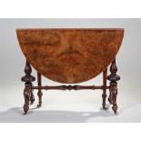 Victorian walnut drop leaf table, the oval top above turned supports and scroll cabriole legs,