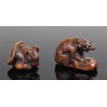 Two 19th Century Japanese carved wood netsuke, the first as a rat clutching a seed, 3.7cm long,