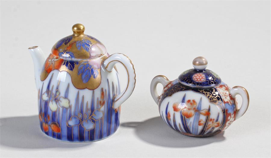 Japanese miniature Fukagawa porcelain miniature coffee pot, the long dome top body with gilt and