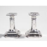 Pair of George V silver candlesticks, Sheffield 1912, maker James Dixon & Sons, the sticks with a