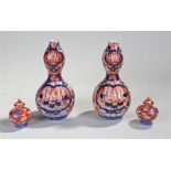 Pair of Japanese Imari vases, decorated in reds and blues with a central dragon, 19cm high, together