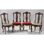 Set of four 18th Century French beech chairs, the scroll shell carved back above a serpentine seat