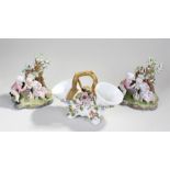 Two porcelain Figural groups, with two figures to each, together with a porcelain Spoon Warmer, (3)