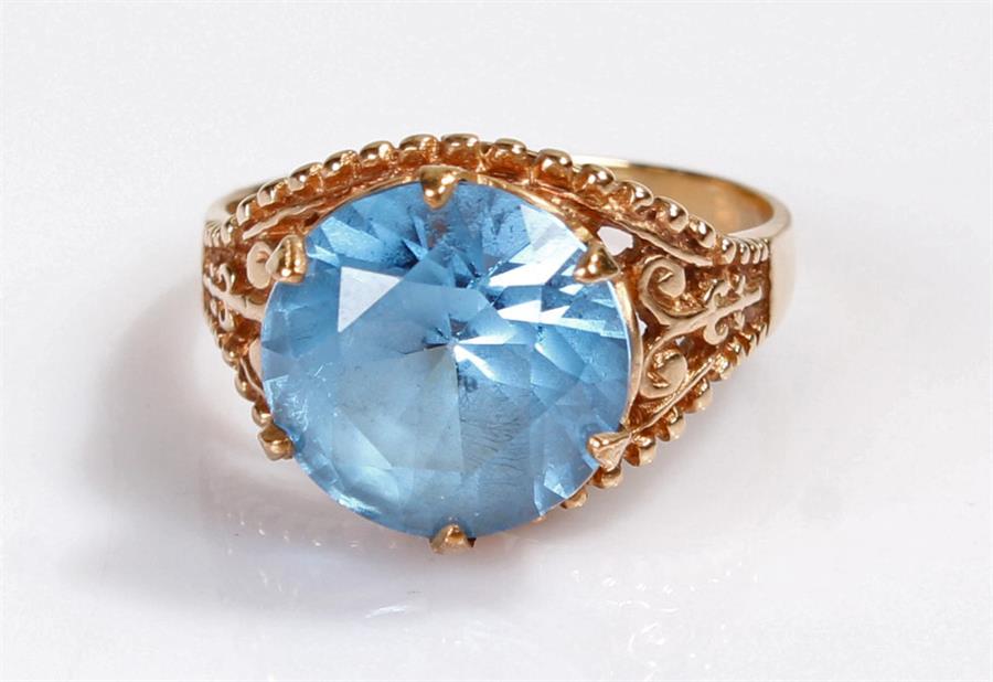 9 carat gold ring with blue stone.