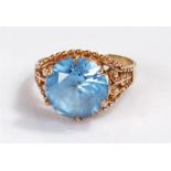 9 carat gold ring with blue stone.