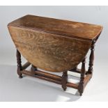 18th Century oak gateleg table, the drop flap top above turned legs united by stretchers, 103cm