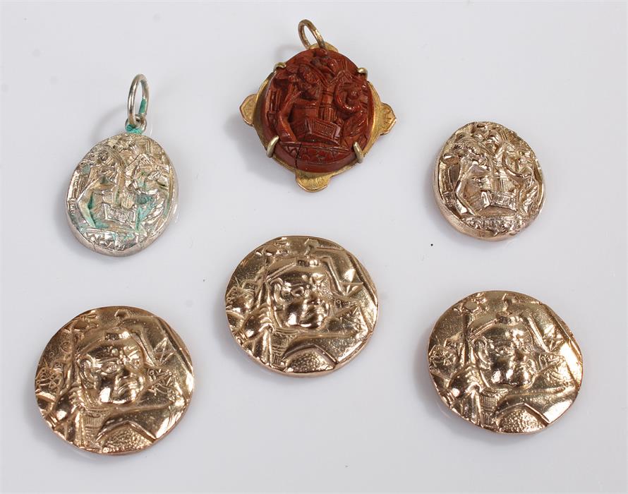 Oriental jewellery, to include a carved nut section on yellow metal back, a pair of silver Chinese