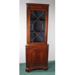 George III style mahogany corner cabinet, with a glazed door above a panel door