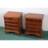 Pair of yew wood bedside cabinets, with rectangular tops above two short and three long drawers, (